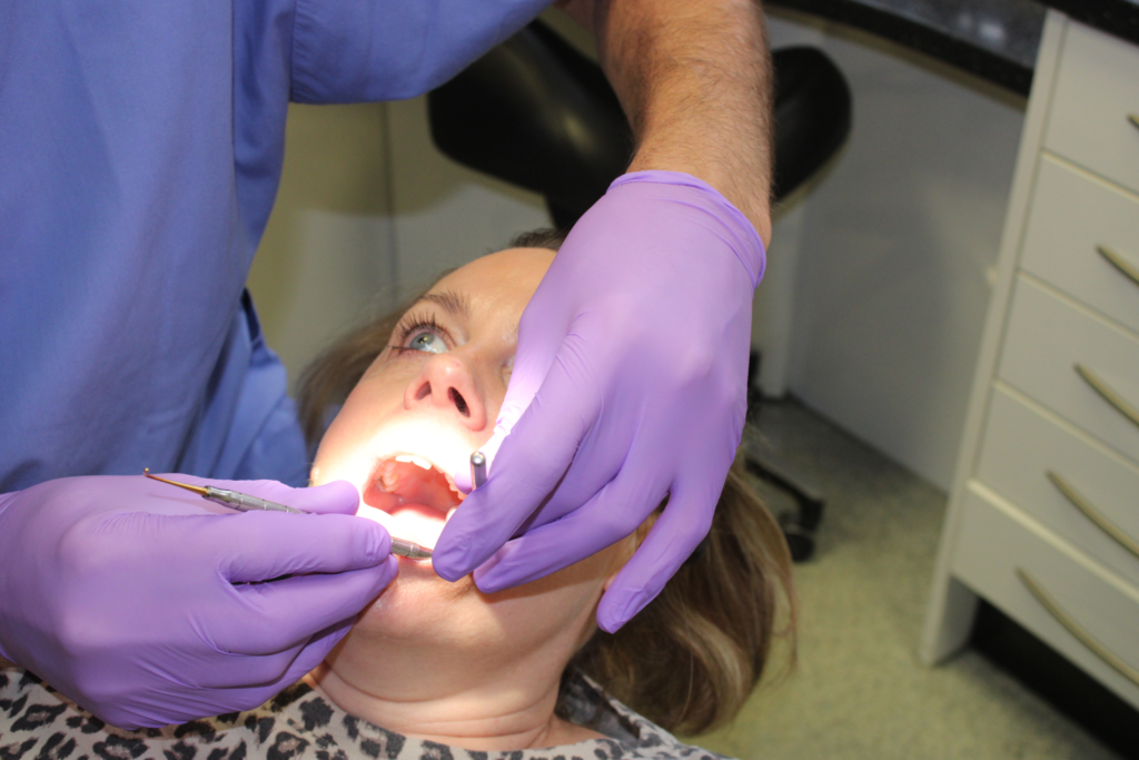 Why you shouldn’t ignore a toothache - Hampshire Dentists Pain Free Dentist in Southampton Patient having treatment in the dental chair to resolve a dental emergency