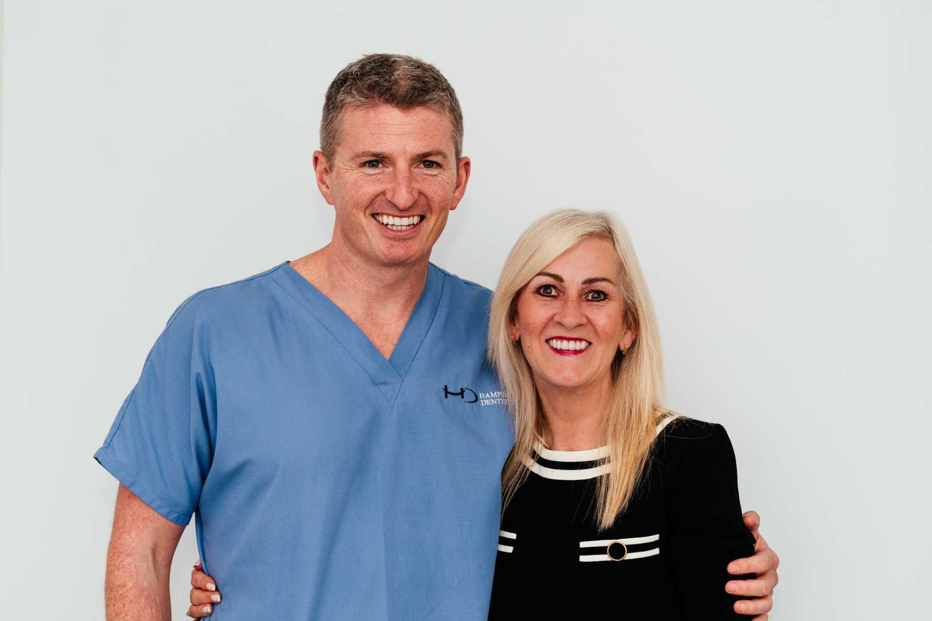 Dr. Robin Hanna and a patient, stand together, showing supportive Hampshire Dentists care