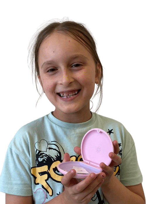 Children’s Braces - Hampshire Dentists Pain Free Dentist in Southampton Child patient shower her Invisalign First aligners in their case