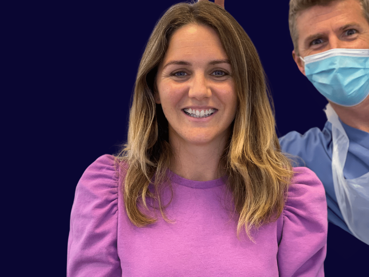 Jill, Practice Owner - Hampshire Dentists Pain Free Dentist in Southampton Jill's first day with invisible fixed braces with a cheeky dentist husband in the background.