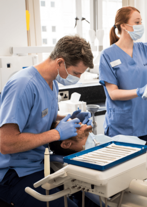 Dental Health Check - Hampshire Dentists Pain Free Dentist in Southampton Dr Robin Hanna examining patient during Dental Health Check